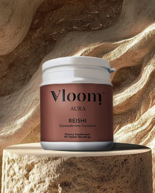Vloom Aura Reishi supplement container on a textured stone background