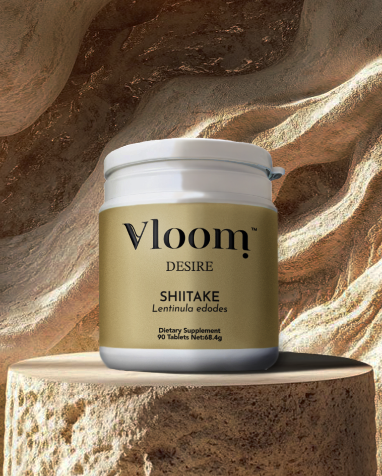 Vloom Desire Shiitake dietary supplement jar on a stone surface with a stone background