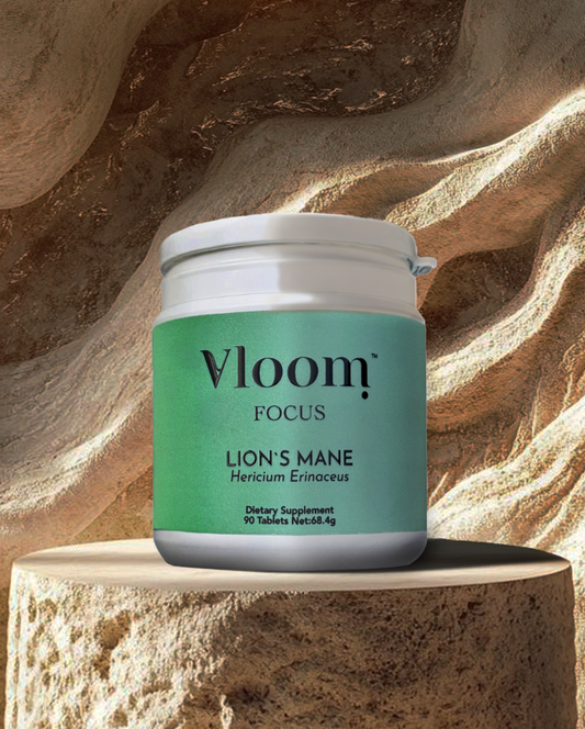 Vloom Focus dietary supplement jar on a textured stone background