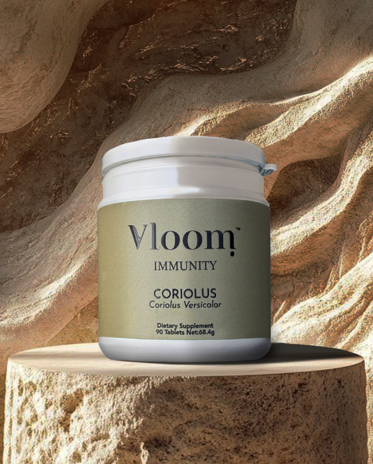 Vloom Immunity supplement container on a stone surface