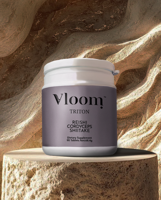 Vloom Triton dietary supplement jar on a textured stone surface